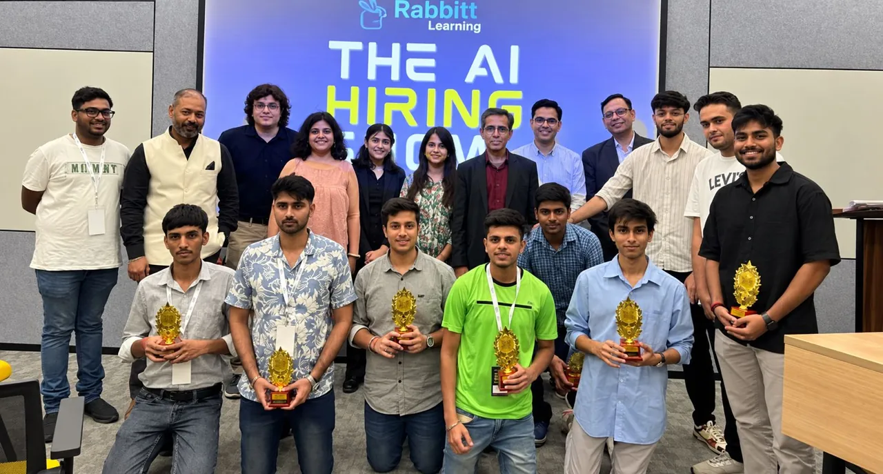 Participants holding trophies at an AI hiring event